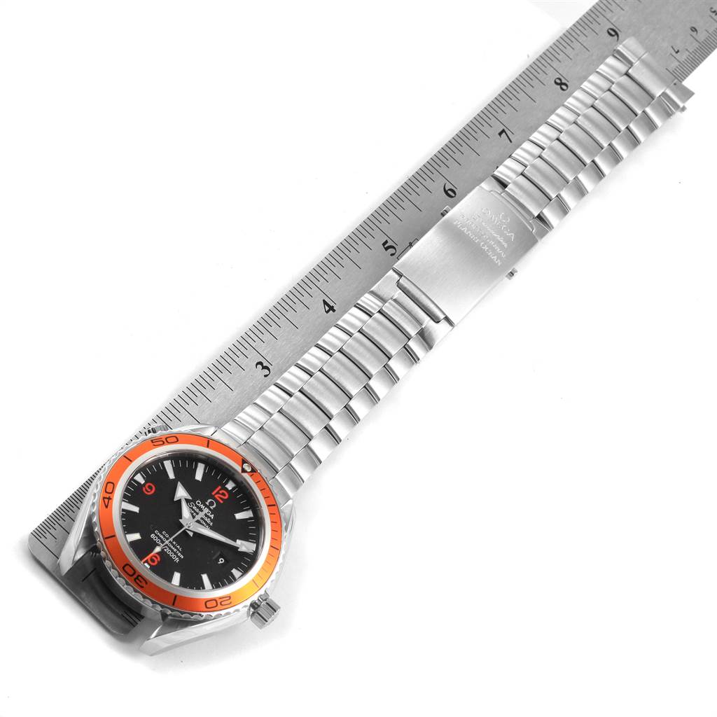 The image shows an Omega Planet Ocean 2208.50.00 Men
s Stainless Steel Black Dial 2208.50.00 Men
s Stainless Steel Black Dial watch laid flat, measured with a ruler for scale.