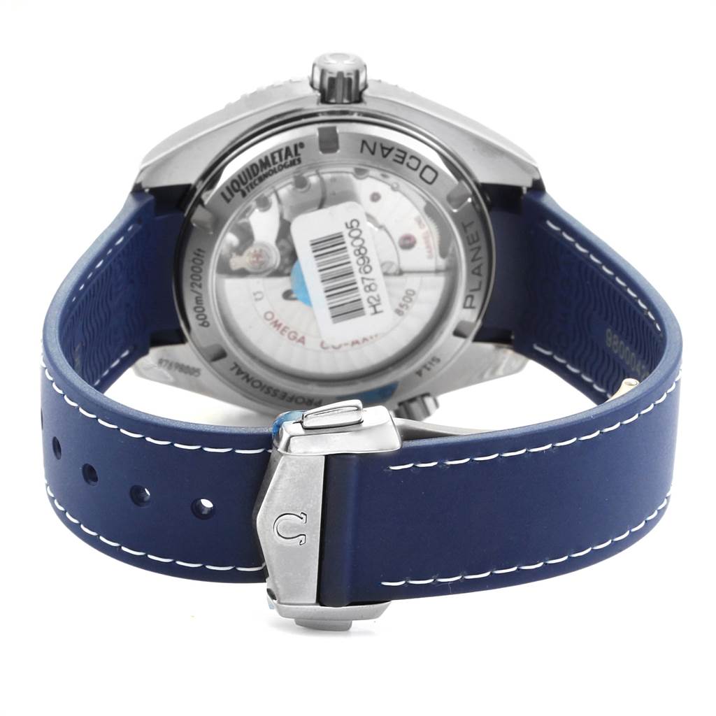 The image shows the back of the Omega Planet Ocean 232.92.42.21.03.001 Men
s Titanium Blue Dial 232.92.42.21.03.001 Men
s Titanium Blue Dial watch, highlighting its blue strap and metal clasp.