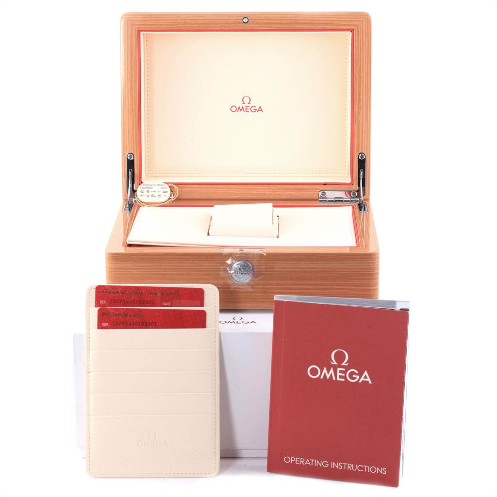 The image shows the packaging, identification cards, and operating instructions for an Omega Planet Ocean 232.92.42.21.03.001 Men
s Titanium Blue Dial 232.92.42.21.03.001 Men
s Titanium Blue Dial model.