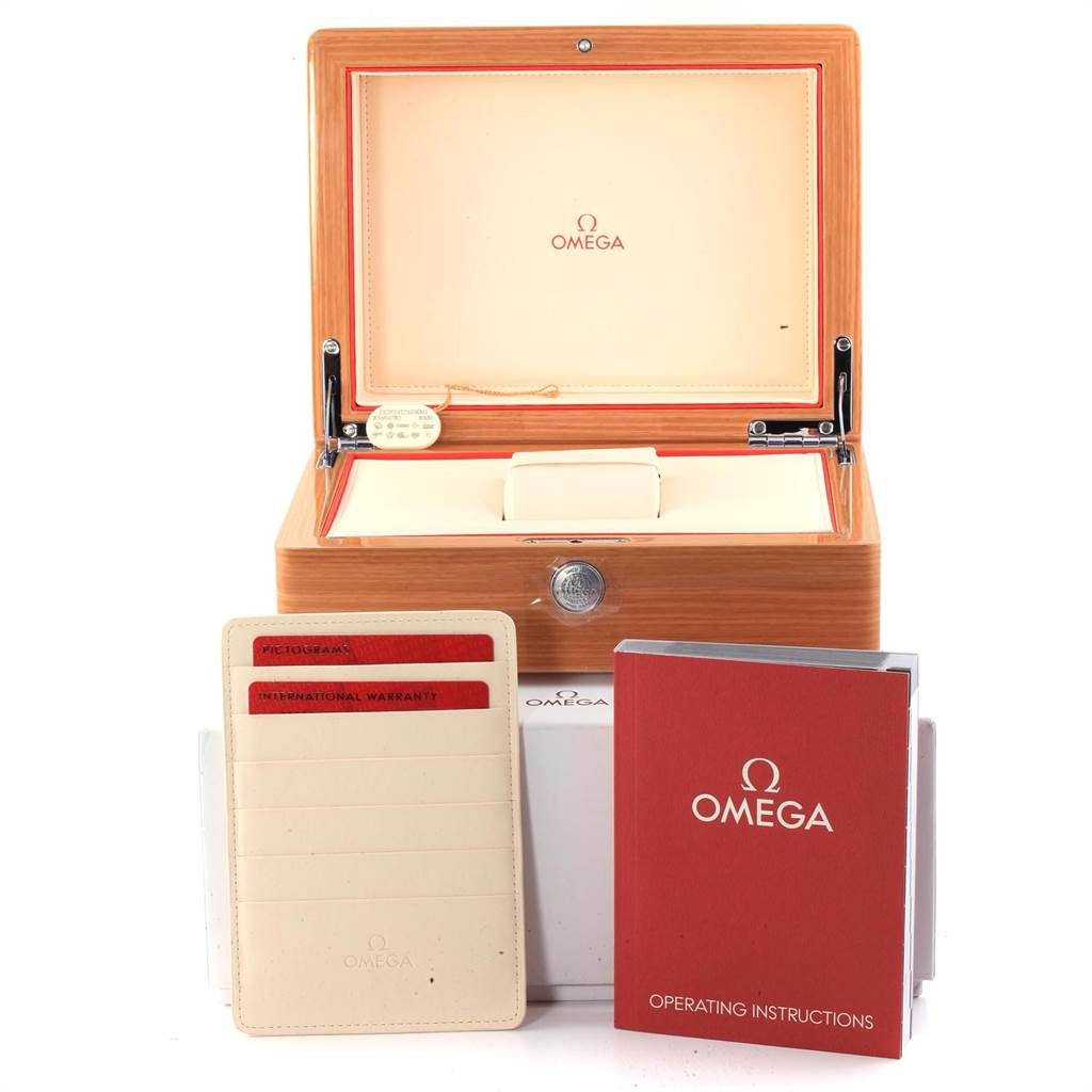 The image shows an open Omega Planet Ocean 232.92.42.21.03.001 Men's Titanium Blue Dial 232.92.42.21.03.001 Men's Titanium Blue Dial watch box with warranty cards and an operating instructions booklet in front.