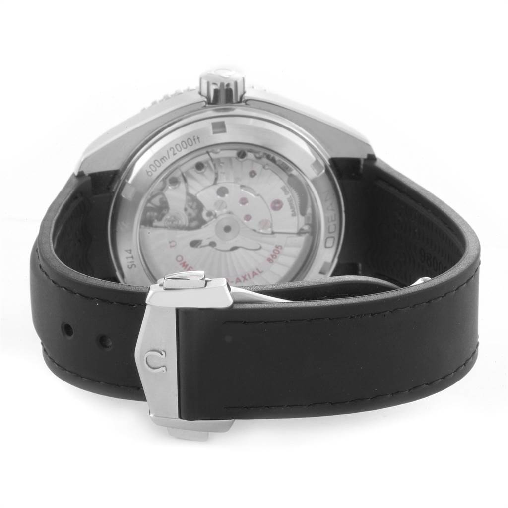 The image shows the back view of the Omega Planet Ocean 232.30.44.22.01.001 Men
s Stainless Steel Black Dial 232.30.44.22.01.001 Men
s Stainless Steel Black Dial watch, highlighting its open case back and black leather strap with a clasp.