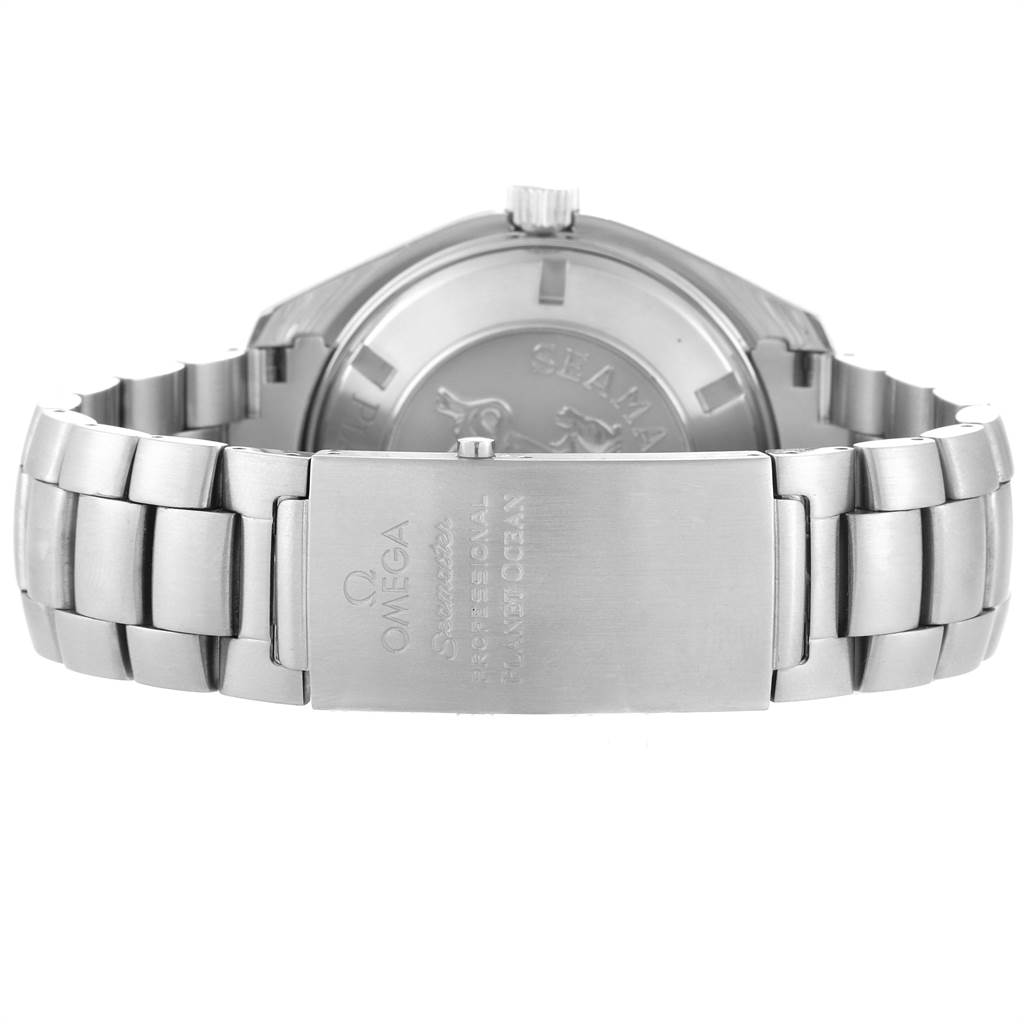 The image shows the back and clasp of an Omega Seamaster Planet Ocean watch, focusing on the stainless steel bracelet and engraved clasp.