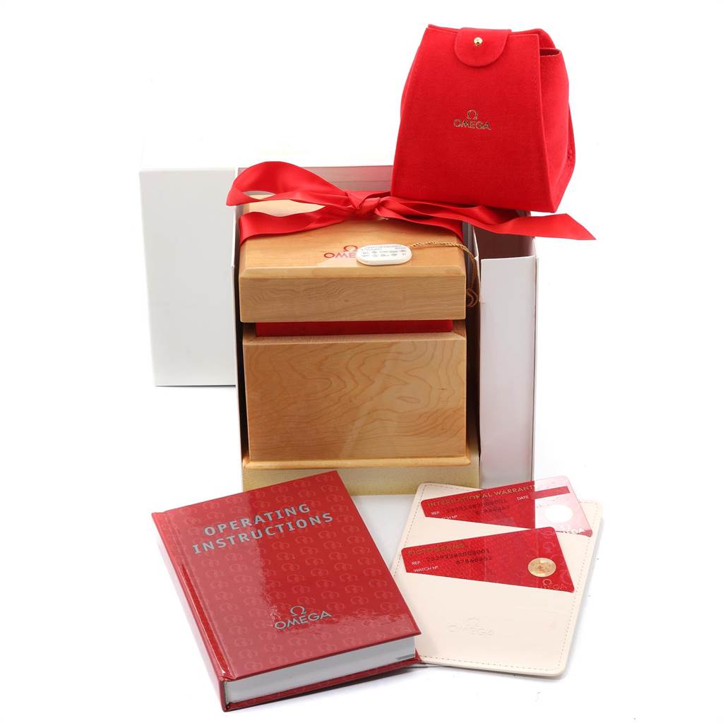 The image shows Omega Planet Ocean 232.92.38.20.03.001 Titanium Blue Dial 232.92.38.20.03.001 Titanium Blue Dial watch accessories including a red pouch, wooden box, operating instructions, and warranty cards.