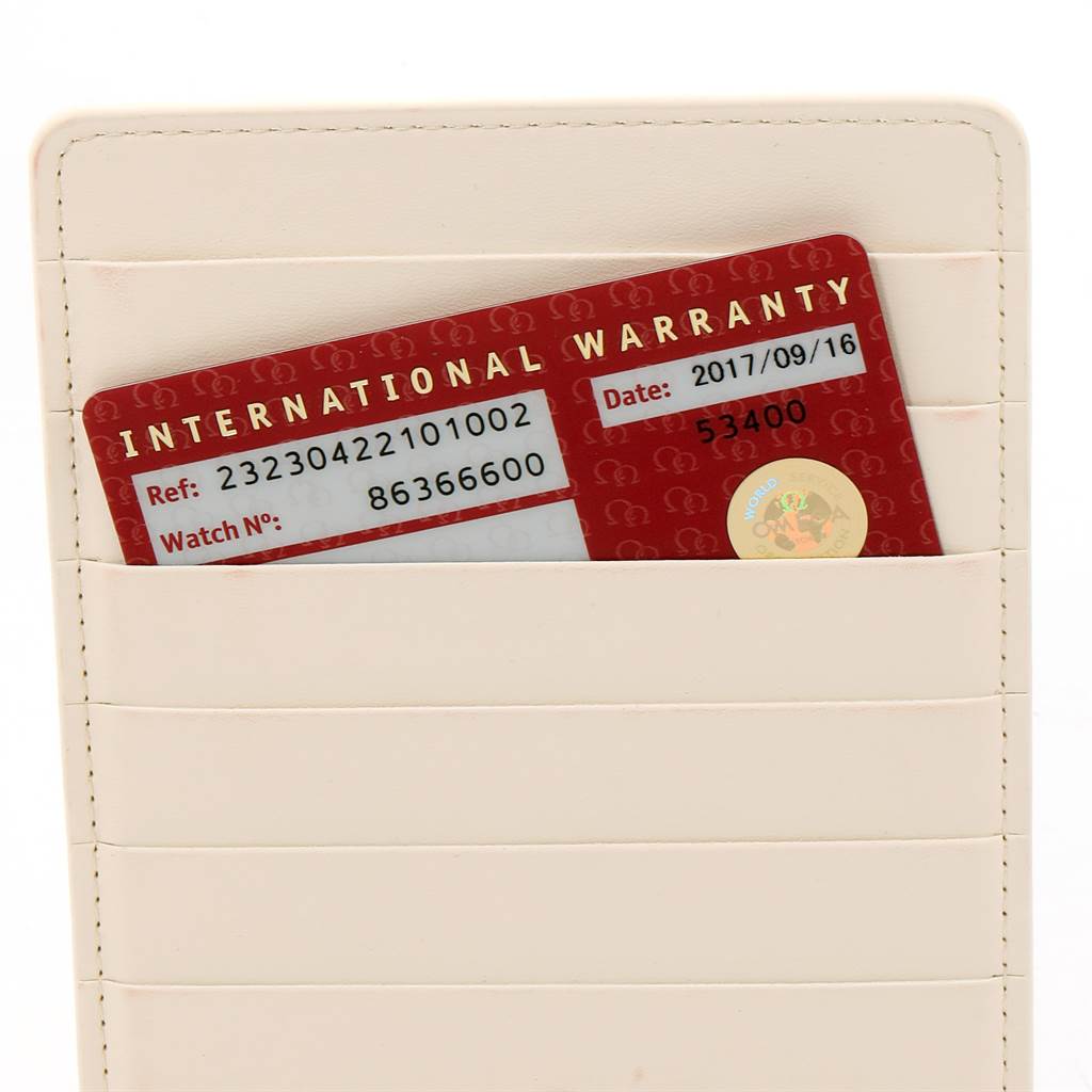 The image shows an International Warranty card for the Omega Planet Ocean 232.30.42.21.01.002 Men
s Stainless Steel Black Dial 232.30.42.21.01.002 Men
s Stainless Steel Black Dial watch, stored in a cream-colored cardholder.