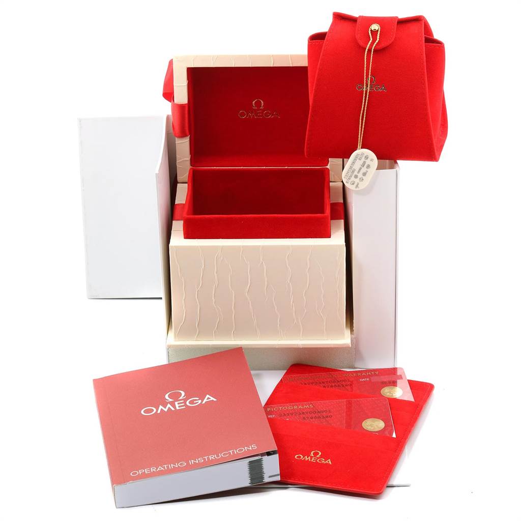 The image shows the packaging and accessories of the Omega Planet Ocean 232.92.38.20.03.001 Titanium Blue Dial 232.92.38.20.03.001 Titanium Blue Dial watch, including the box, pouch, manuals, and cards.