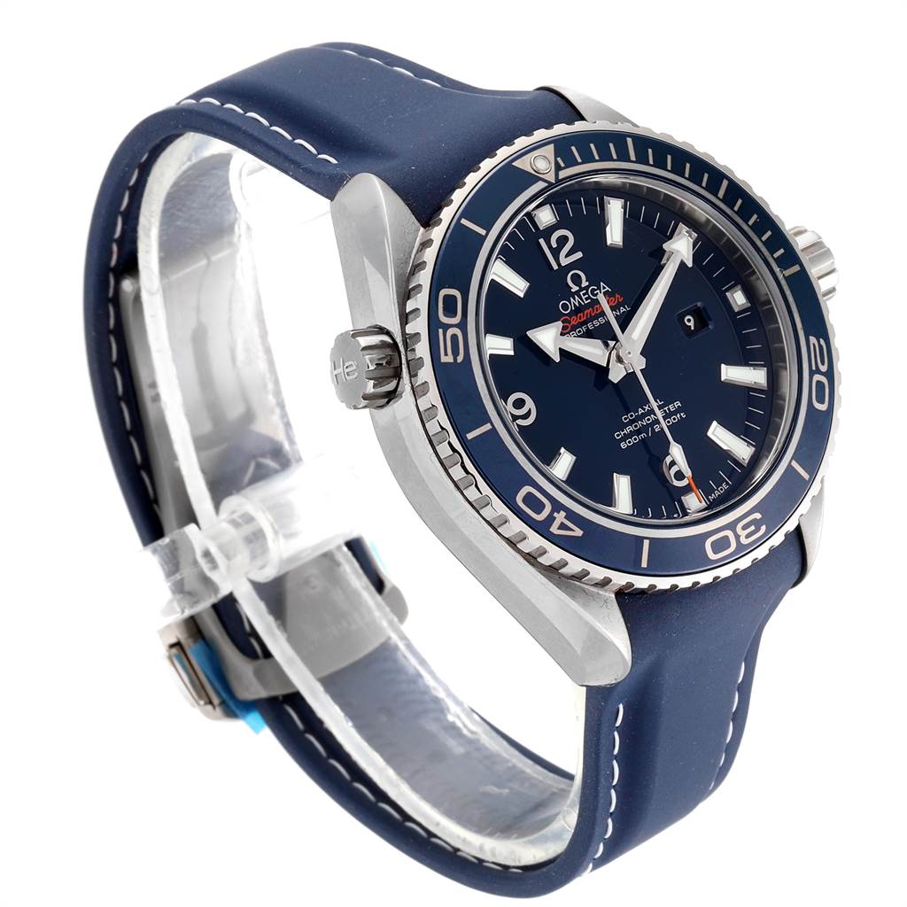 The image shows the Omega Planet Ocean 232.92.38.20.03.001 Titanium Blue Dial 232.92.38.20.03.001 Titanium Blue Dial watch from an oblique angle, highlighting the face, bezel, crown, and blue strap.