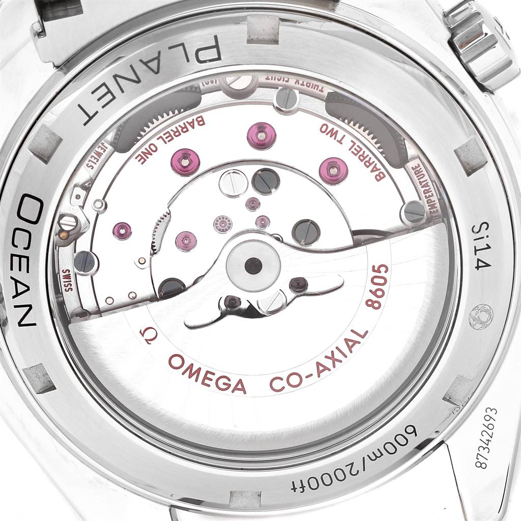 The image shows the back view of the Omega Planet Ocean 232.30.44.22.01.001 Men
s Stainless Steel Black Dial 232.30.44.22.01.001 Men
s Stainless Steel Black Dial watch, highlighting its mechanical movement and Co-Axial escapement.