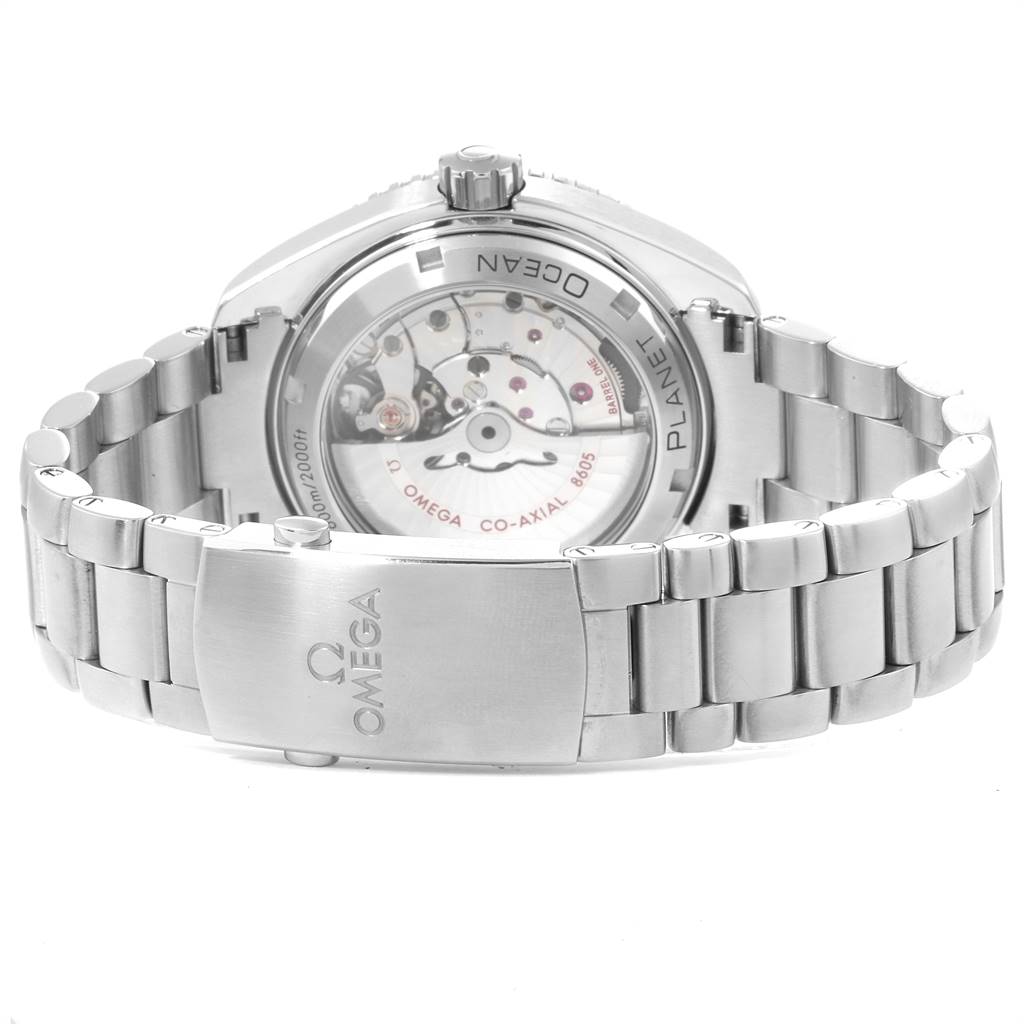 The image shows the back view of the Omega Planet Ocean 232.30.44.22.01.001 Men
s Stainless Steel Black Dial 232.30.44.22.01.001 Men
s Stainless Steel Black Dial watch, highlighting its inner movement and the metal bracelet clasp.