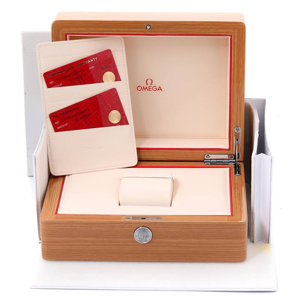 The image shows an open Omega Planet Ocean 232.30.44.22.01.001 Men
s Stainless Steel Black Dial 232.30.44.22.01.001 Men
s Stainless Steel Black Dial watch box with a cardholder containing two red Omega cards.