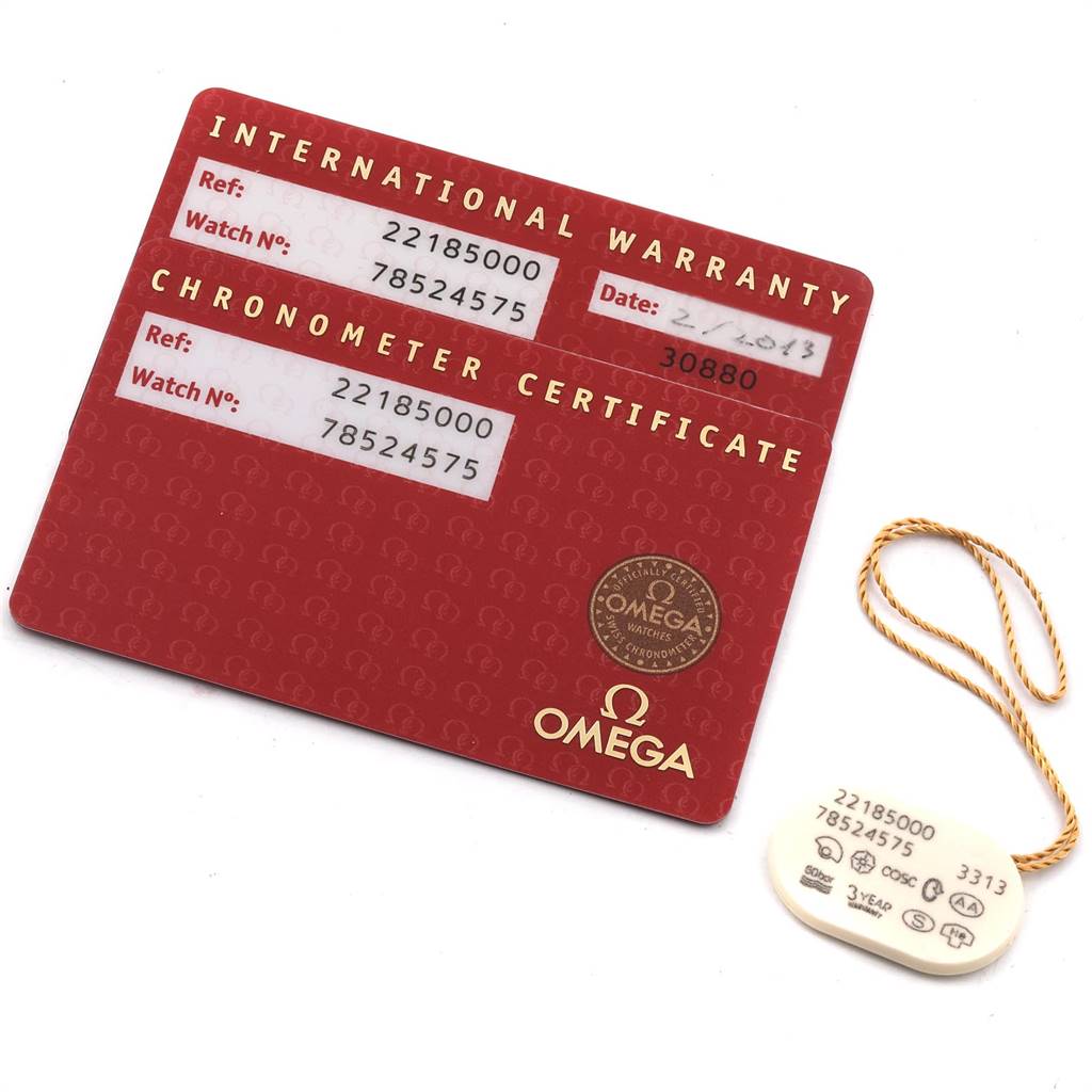 The image shows an Omega Planet Ocean 2218.50.00 Men
s Stainless Steel Black Dial 2218.50.00 Men
s Stainless Steel Black Dial model
s international warranty and chronometer certificate cards, along with a tag.