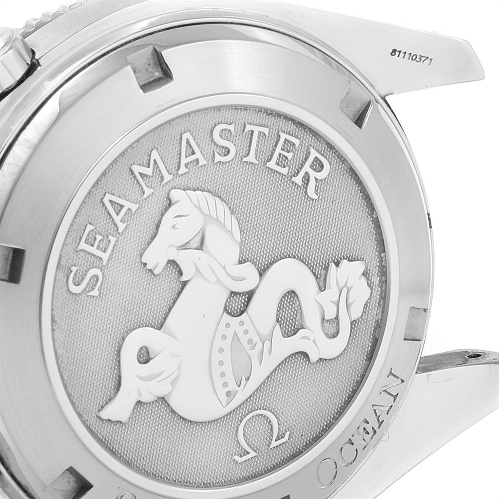 The image shows the back casing of an Omega Seamaster Planet Ocean watch, featuring the brand
s logo and engraving.