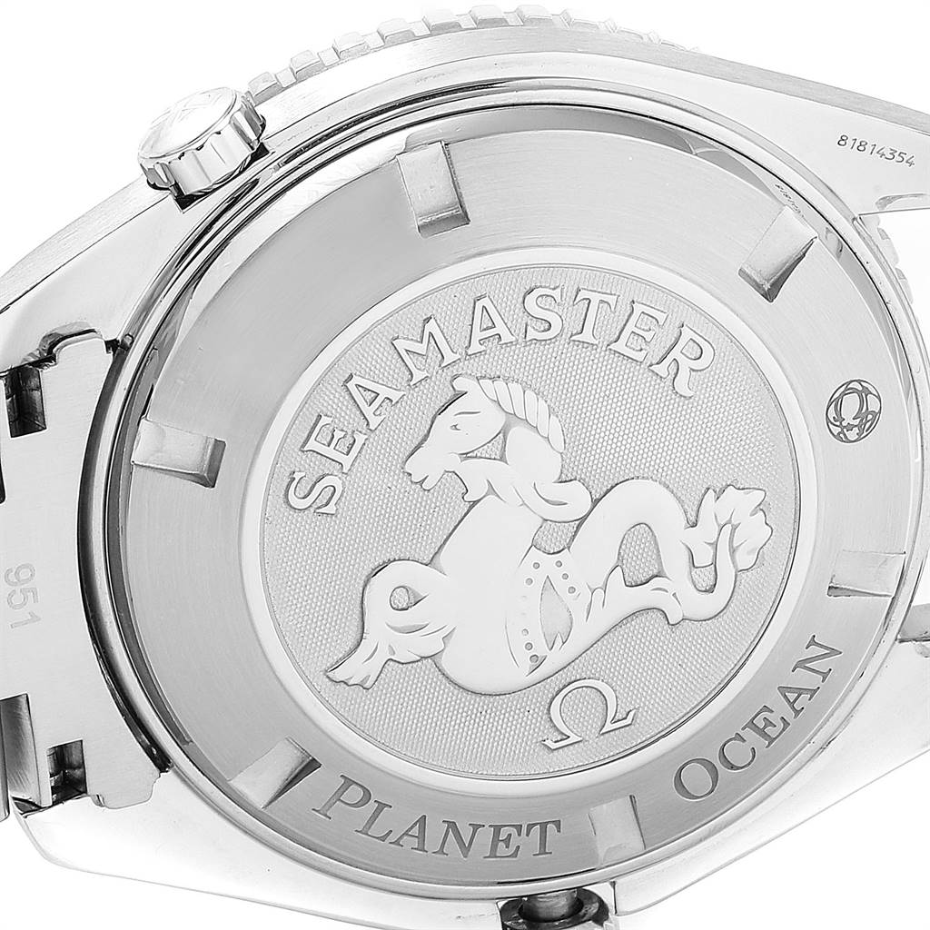 The image shows the case back of an Omega Seamaster Planet Ocean watch, highlighting the engraved logo and text.