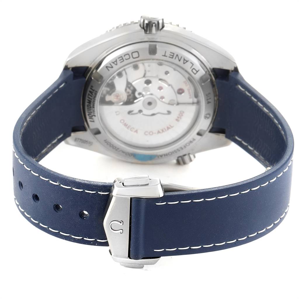 The image shows the back view of the Omega Planet Ocean 232.92.42.21.03.001 Men
s Titanium Blue Dial 232.92.42.21.03.001 Men
s Titanium Blue Dial watch, highlighting its case back and blue strap with buckle.
