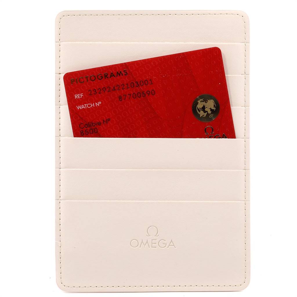 The image shows an Omega certification card for the Planet Ocean model in a white Omega-branded cardholder.