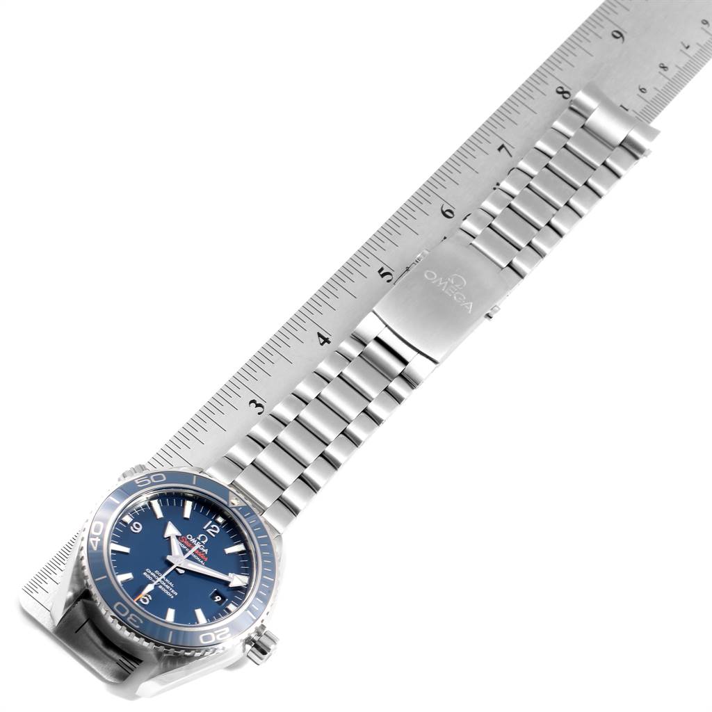 The image shows an Omega Planet Ocean 232.90.46.21.03.001 Men's Titanium Blue Dial 232.90.46.21.03.001 Men's Titanium Blue Dial watch, including the face, bezel, crown, and full metal bracelet with a clasp, measured with a ruler.