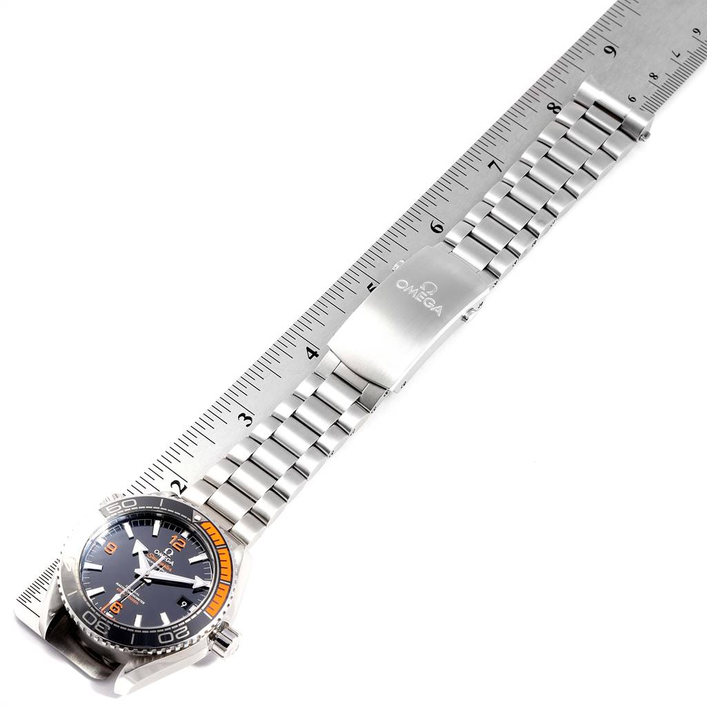 The image shows a top view of an Omega Planet Ocean 215.30.44.21.01.002 Men
s Stainless Steel Black Dial 215.30.44.21.01.002 Men
s Stainless Steel Black Dial watch, highlighting its face and stainless steel bracelet with a clasp.