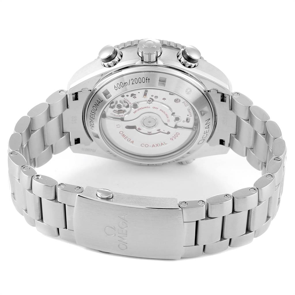 The image shows the back view of an Omega Planet Ocean 232.30.46.51.01.001 Men
s Stainless Steel Black Dial 232.30.46.51.01.001 Men
s Stainless Steel Black Dial watch, highlighting the movement and metal bracelet.