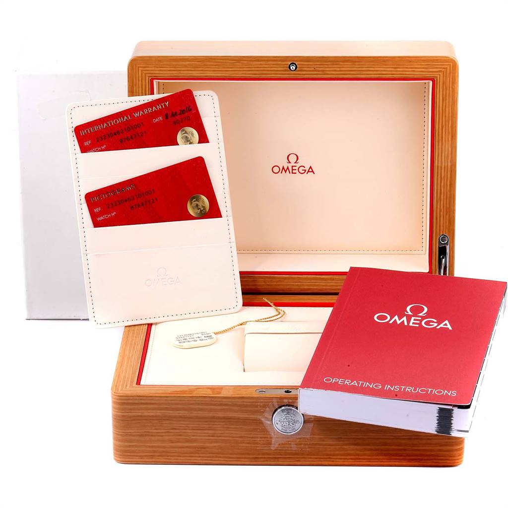 The image shows the Omega Planet Ocean 232.30.46.21.01.001 Men
s Stainless Steel Black Dial 232.30.46.21.01.001 Men
s Stainless Steel Black Dial watch box, warranty cards, and operating instructions from a front angle.