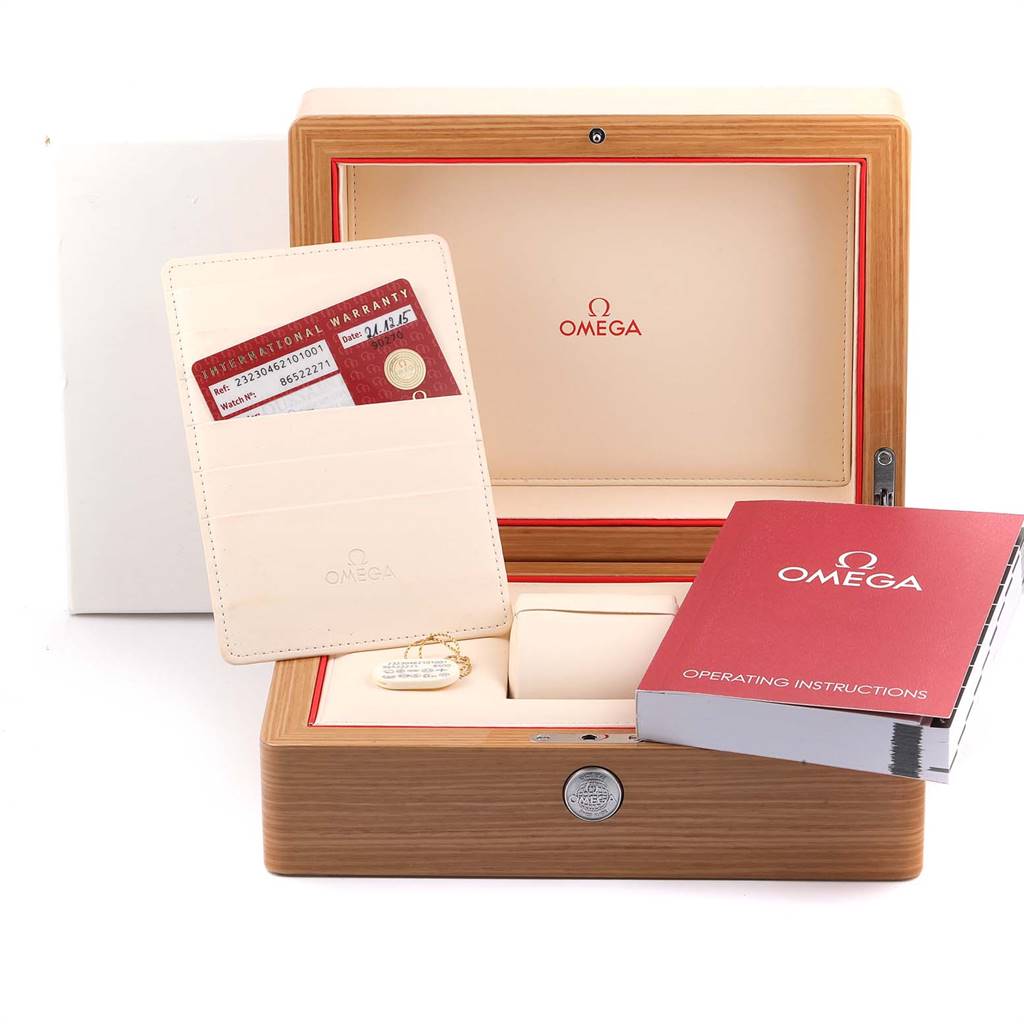 The image shows an Omega Planet Ocean 232.30.46.21.01.001 Men
s Stainless Steel Black Dial 232.30.46.21.01.001 Men
s Stainless Steel Black Dial watch box, warranty cards, and operating instructions from a front angle.