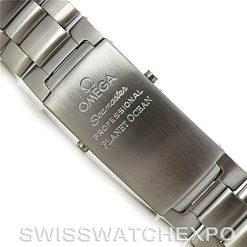 The image shows the clasp and bracelet of an Omega Seamaster Planet Ocean watch from an angled top view.