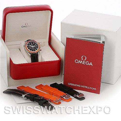 This image shows an Omega Planet Ocean 2918.50.82 Men's Stainless Steel Black Dial 2918.50.82 Men's Stainless Steel Black Dial watch at an angle inside its box, with additional straps and an instruction manual.
