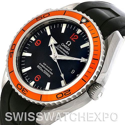 The image shows an Omega Planet Ocean 2908.50.91 Men
s Stainless Steel Black Dial 2908.50.91 Men
s Stainless Steel Black Dial watch at a tilted angle, highlighting the orange bezel, black dial, and part of the black strap.