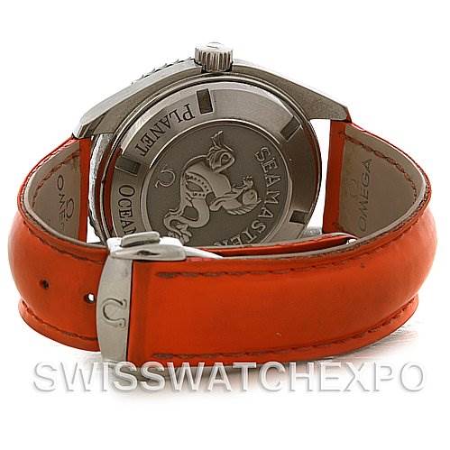 The image shows the back case and orange leather strap of an Omega Planet Ocean 2908.50.83 Men's Stainless Steel Black Dial 2908.50.83 Men's Stainless Steel Black Dial watch at an angled rear view.