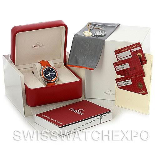 The image shows an Omega Planet Ocean 2908.50.83 Men's Stainless Steel Black Dial 2908.50.83 Men's Stainless Steel Black Dial watch angled from the front, with its box, manual, cards, and a protective cloth included.