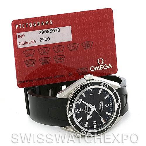 The image shows the Omega Planet Ocean 2900.50.91 Men's Stainless Steel Black Dial 2900.50.91 Men's Stainless Steel Black Dial watch resting on its side with a red Omega pictograms card behind it.