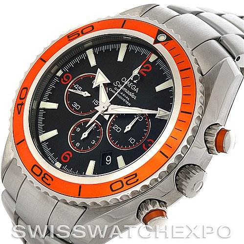 The image shows an Omega Planet Ocean 2218.50.00 Men
s Stainless Steel Black Dial 2218.50.00 Men
s Stainless Steel Black Dial watch from an angled top view, highlighting its bezel, dial, and bracelet.