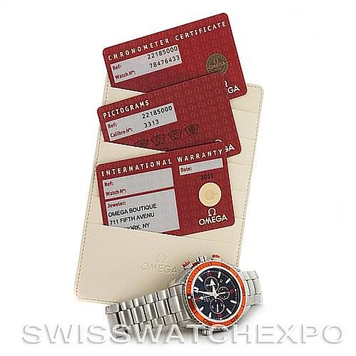 The image shows an Omega Planet Ocean 2218.50.00 Men
s Stainless Steel Black Dial 2218.50.00 Men
s Stainless Steel Black Dial watch placed alongside its warranty cards and certification documents.