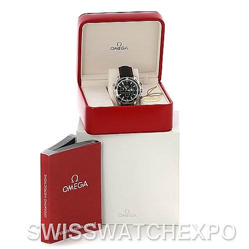 The image shows an Omega Planet Ocean 2910.51.82 Men's Stainless Steel Black Dial 2910.51.82 Men's Stainless Steel Black Dial watch in its open red box, alongside its user manual and white outer box.