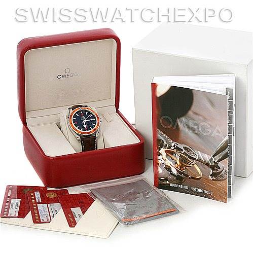 The image shows an Omega Planet Ocean 2908.50.91 Men's Stainless Steel Black Dial 2908.50.91 Men's Stainless Steel Black Dial watch with its open box, instruction manual, and certification cards.