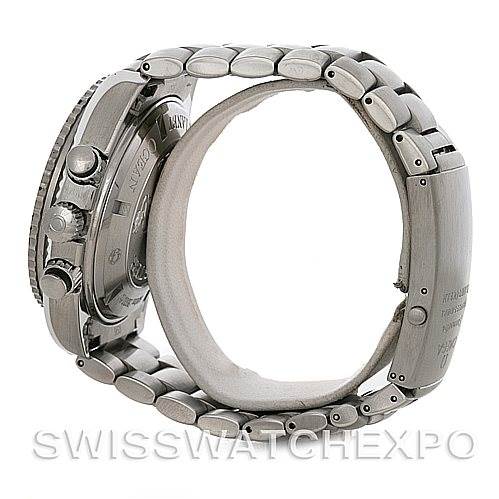 The image shows a side view of an Omega Planet Ocean 2210.51.00 Men's Stainless Steel Black Dial 2210.51.00 Men's Stainless Steel Black Dial watch, focusing on the case, crown, pushers, and bracelet.