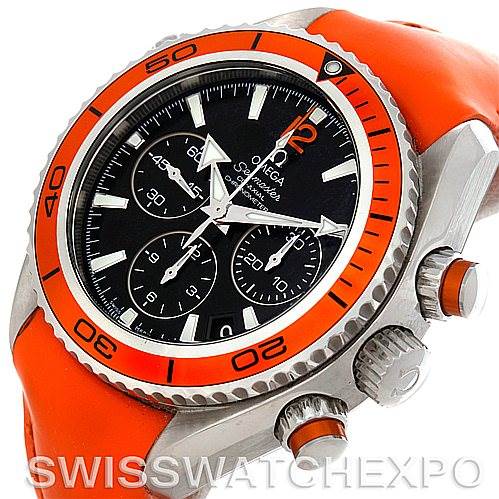 The image shows an angled view of an Omega Planet Ocean 222.32.38.50.01.003 Women
s Stainless Steel Black Dial 222.32.38.50.01.003 Women
s Stainless Steel Black Dial watch, highlighting the bezel, crown, chronograph, and orange strap.