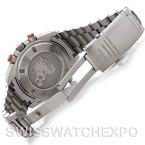The image shows the back case and bracelet clasp of the Omega Seamaster Planet Ocean watch.