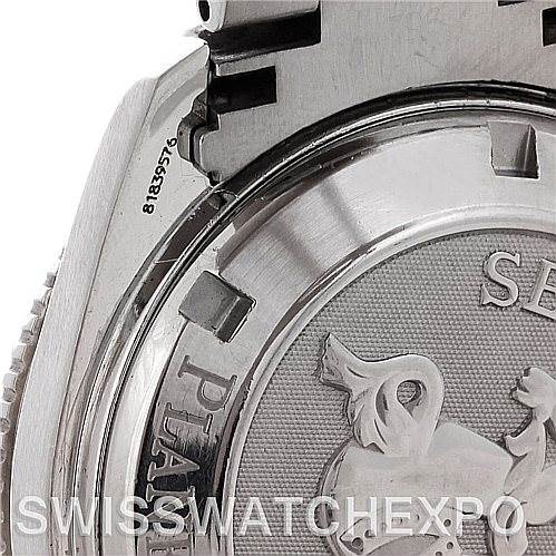 The image shows a close-up of the back case and part of the metal strap of an Omega Planet Ocean 2201.50.00 Men
s Stainless Steel Black Dial 2201.50.00 Men
s Stainless Steel Black Dial watch.