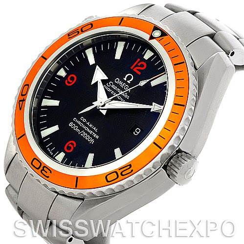 The image shows an angled view of the front and right side of the Omega Planet Ocean 2208.50.00 Men's Stainless Steel Black Dial 2208.50.00 Men's Stainless Steel Black Dial model watch, highlighting its orange bezel and metal bracelet.