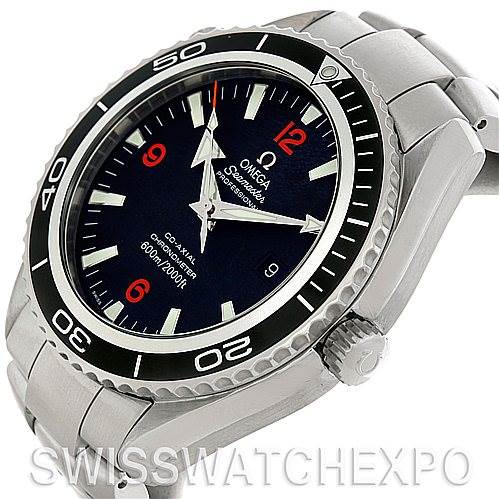 The image shows a side angle of the Omega Planet Ocean 2200.51.00 Men's Stainless Steel Black Dial 2200.51.00 Men's Stainless Steel Black Dial watch, highlighting the bezel, crown, dial, and stainless steel bracelet.