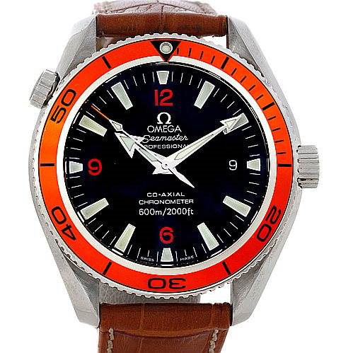 The Omega Planet Ocean watch is shown from the front, displaying the face, bezel, and part of the leather strap.