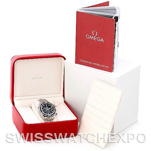The image shows a Planet Ocean model by Omega in its opened red box, alongside an operating instructions booklet and a white cardholder.