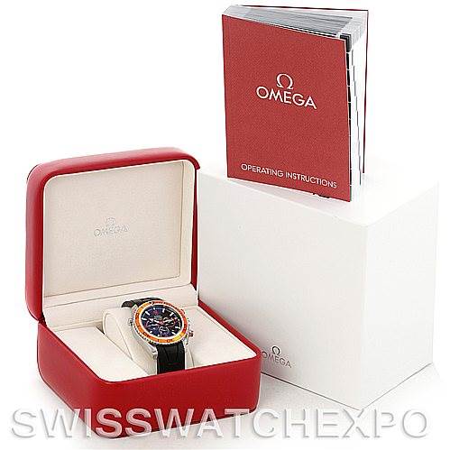 This image shows the Omega Planet Ocean 2918.50.91 Men's Stainless Steel Black Dial 2918.50.91 Men's Stainless Steel Black Dial watch in its red case, along with the operating instructions booklet.