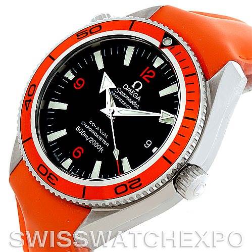 The image shows the Omega Planet Ocean 2909.50.83 Men
s Stainless Steel Black Dial 2909.50.83 Men
s Stainless Steel Black Dial watch at an angle highlighting the face, bezel, crown, and part of the orange strap.