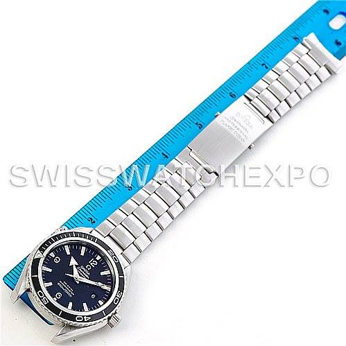 The Omega Planet Ocean 2200.50.00 Men's Stainless Steel Black Dial 2200.50.00 Men's Stainless Steel Black Dial watch is shown laid flat with its stainless steel bracelet and clasp, next to a blue ruler for scale.