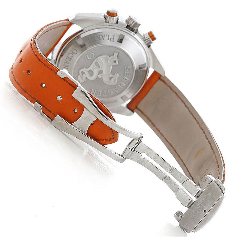 The image shows the back and clasp of an Omega Planet Ocean 2918.50.83 Men's Stainless Steel Black Dial 2918.50.83 Men's Stainless Steel Black Dial watch, highlighting its orange strap and metal deployment clasp.
