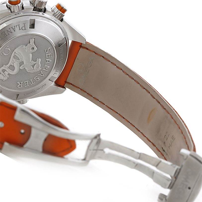 The image shows the back case and strap of an Omega Planet Ocean 2918.50.83 Men's Stainless Steel Black Dial 2918.50.83 Men's Stainless Steel Black Dial watch, featuring a Seamaster engraving and an orange-lined leather strap.