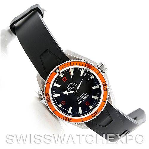 The image shows an Omega Planet Ocean 2909.50.91 Men's Stainless Steel Black Dial 2909.50.91 Men's Stainless Steel Black Dial watch from a top-left angle, highlighting the orange bezel, black dial, and rubber strap.