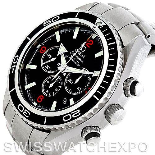 The image shows an angled view of the Omega Planet Ocean 2210.51.00 Men's Stainless Steel Black Dial 2210.51.00 Men's Stainless Steel Black Dial watch, highlighting the face, bezel, and side pushers.