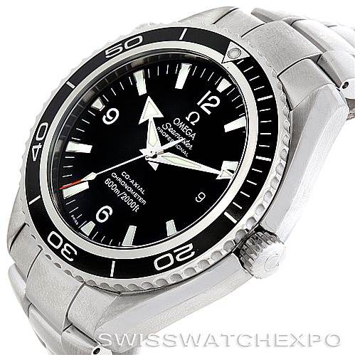 The image shows an angled view of the Omega Planet Ocean 2200.50.00 Men's Stainless Steel Black Dial 2200.50.00 Men's Stainless Steel Black Dial watch displaying the dial, bezel, and part of the bracelet.