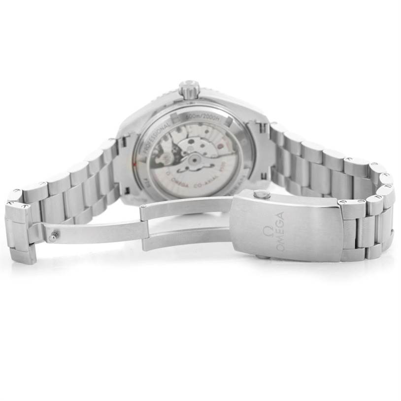 The image shows the back view of an Omega Planet Ocean 232.30.42.21.01.003 Men's Stainless Steel Black Dial 232.30.42.21.01.003 Men's Stainless Steel Black Dial watch, displaying the open clasp and movement through the transparent case back.